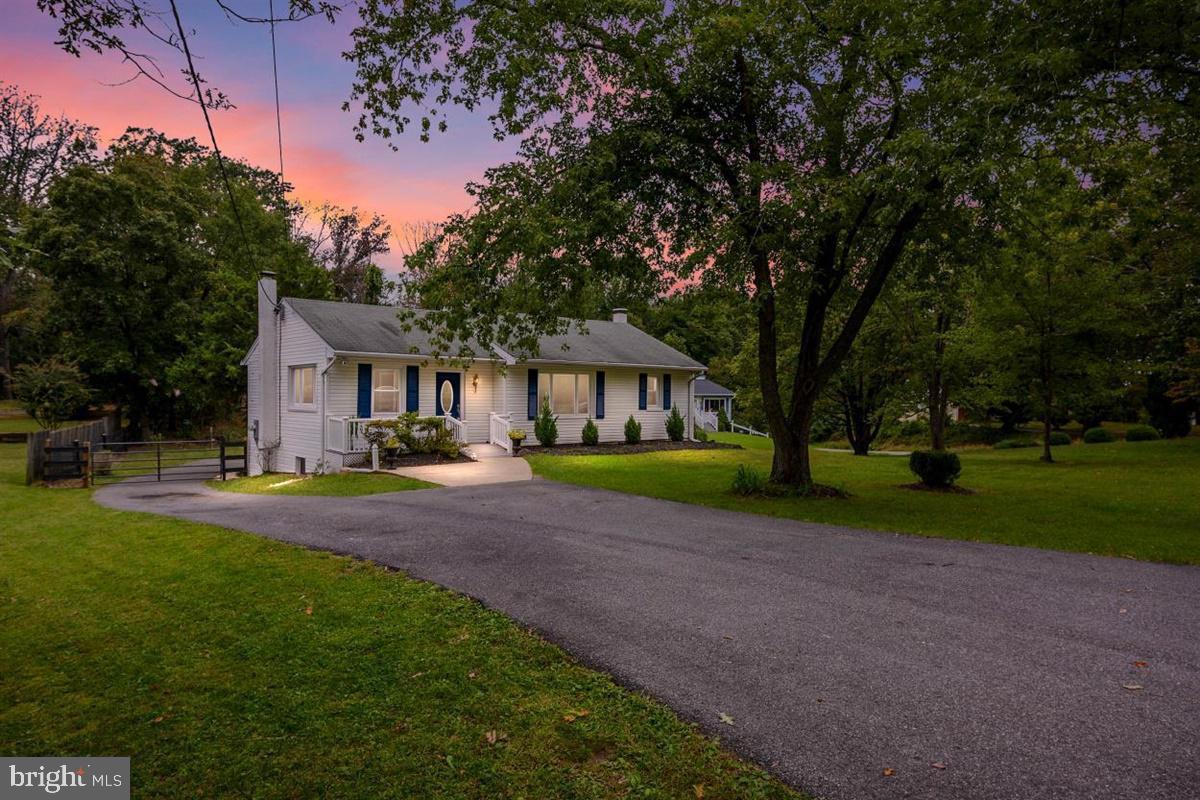 Charming home at sunset, serene setting.
