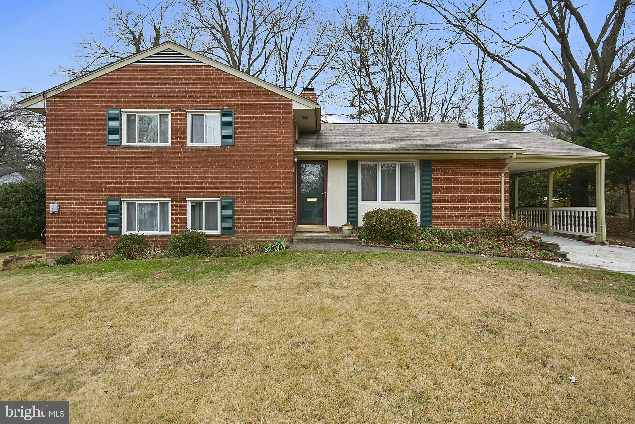 7405 Chatham Street Springfield, VA 22151 - Photo 1 of 30 a front view of a house with garden