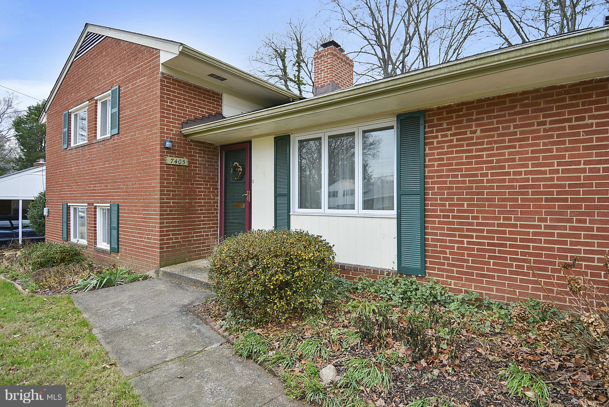 7405 Chatham Street Springfield, VA 22151 - Photo 2 of 30 a view of a brick house with large windows