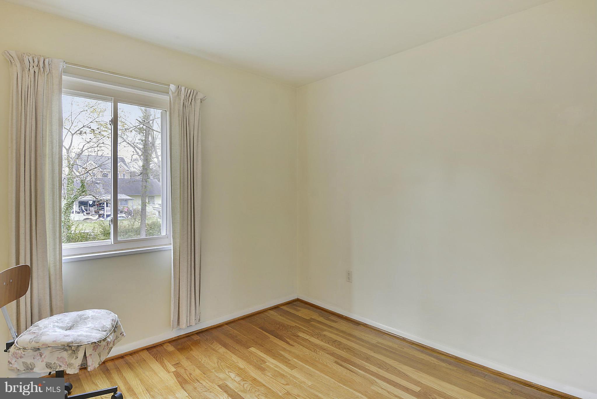 7405 Chatham Street Springfield, VA 22151 - Photo 24 of 30 a view of a room with wooden floor and bedroom