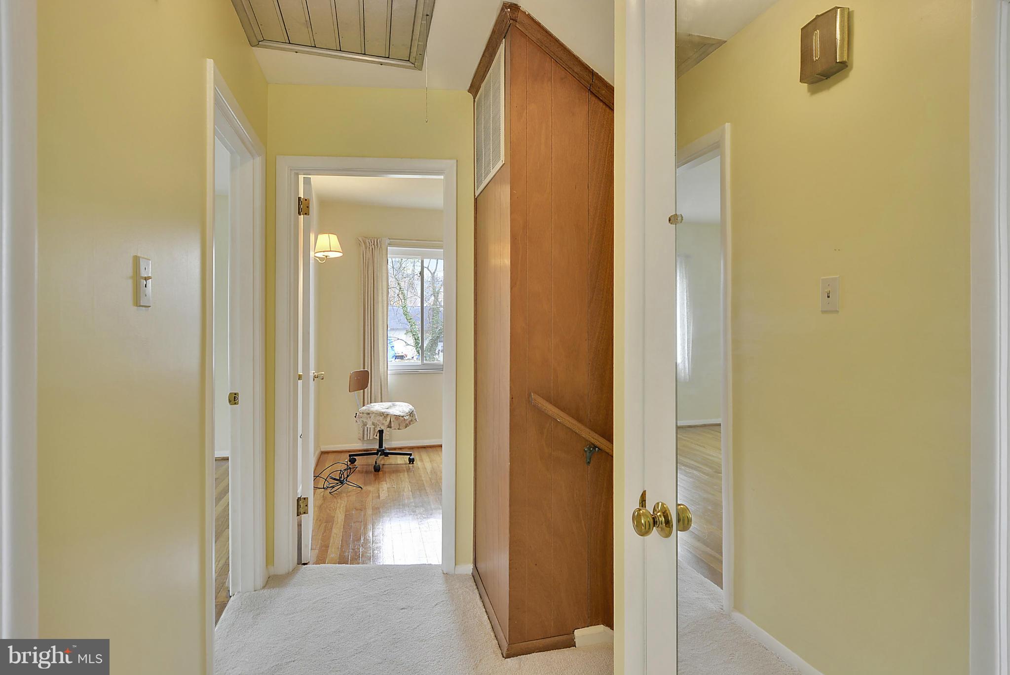 7405 Chatham Street Springfield, VA 22151 - Photo 25 of 30 a view of a bathroom with a tub and a mirror
