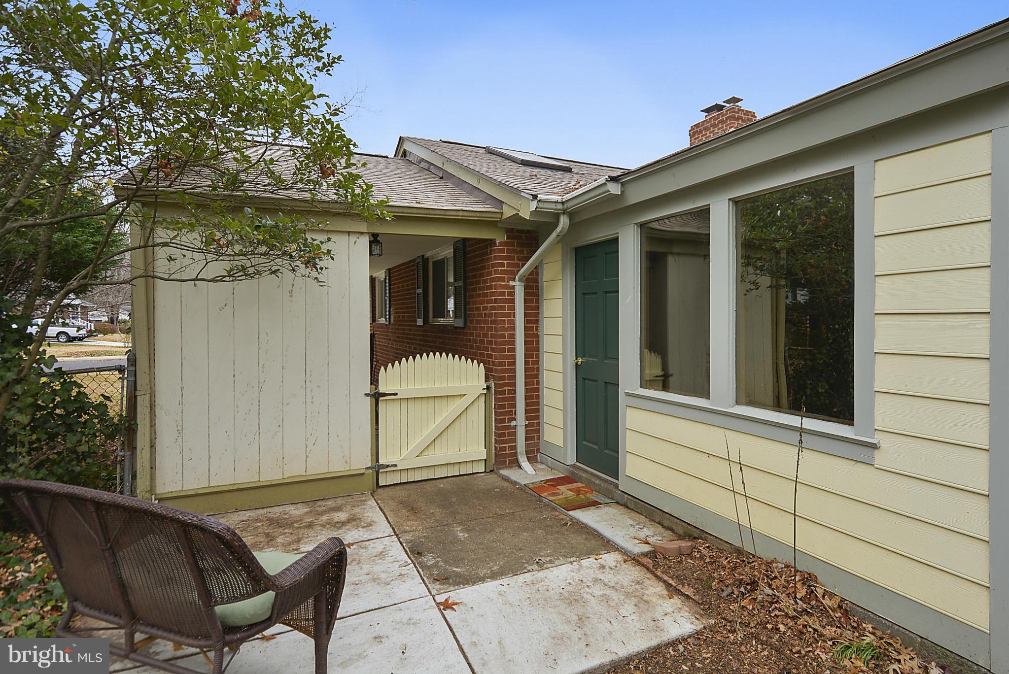 7405 Chatham Street Springfield, VA 22151 - Photo 27 of 30 a view of a house with a backyard and sitting area