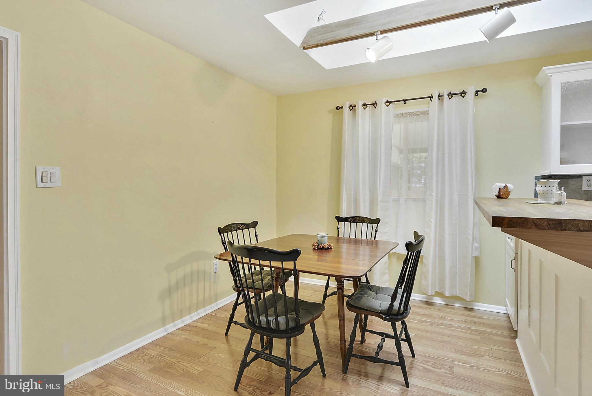 7405 Chatham Street Springfield, VA 22151 - Photo 7 of 30 a view of a dining room with furniture and wooden floor