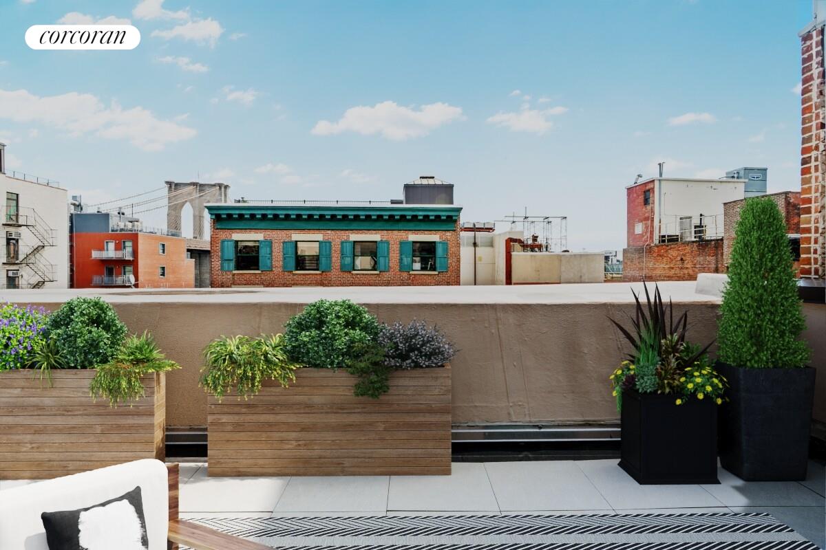 264 Water Street, Unit PHA Manhattan, NY 10038 - Photo 11 of 14 a view of a house with a bench