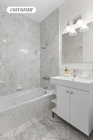 a living room with furniture and a lamp