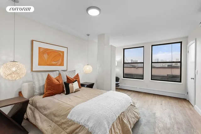 a bedroom with a bed and a couch