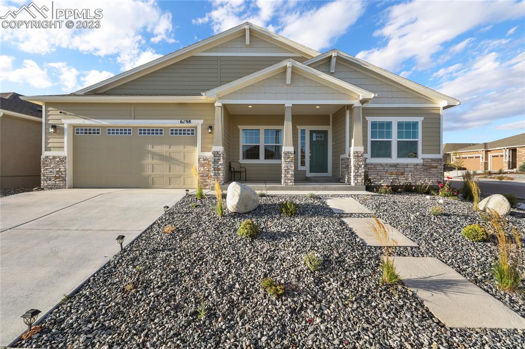 Stunning ranch style home on a corner lot in popular Wolf Ranch East