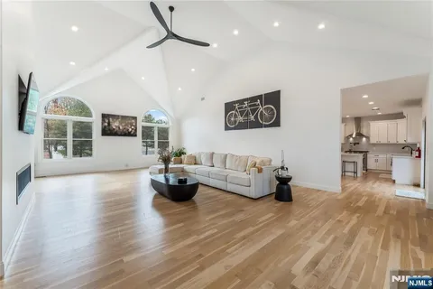 a living room with furniture and kitchen view