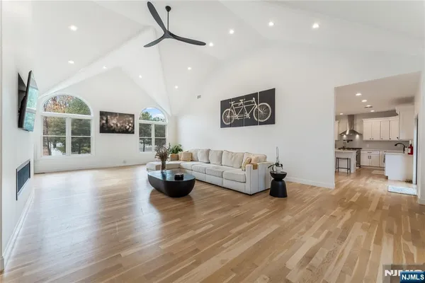 a living room with furniture and kitchen view