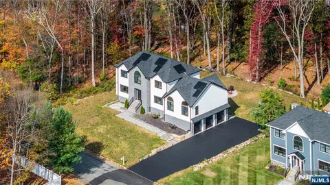 aerial view of a house with a yard