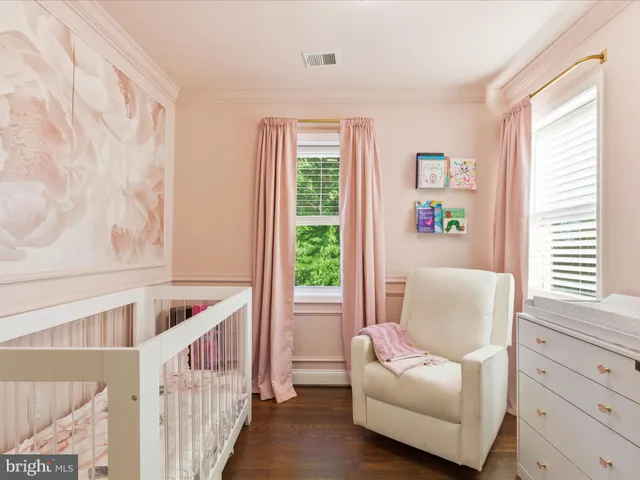 a living room with furniture and windows