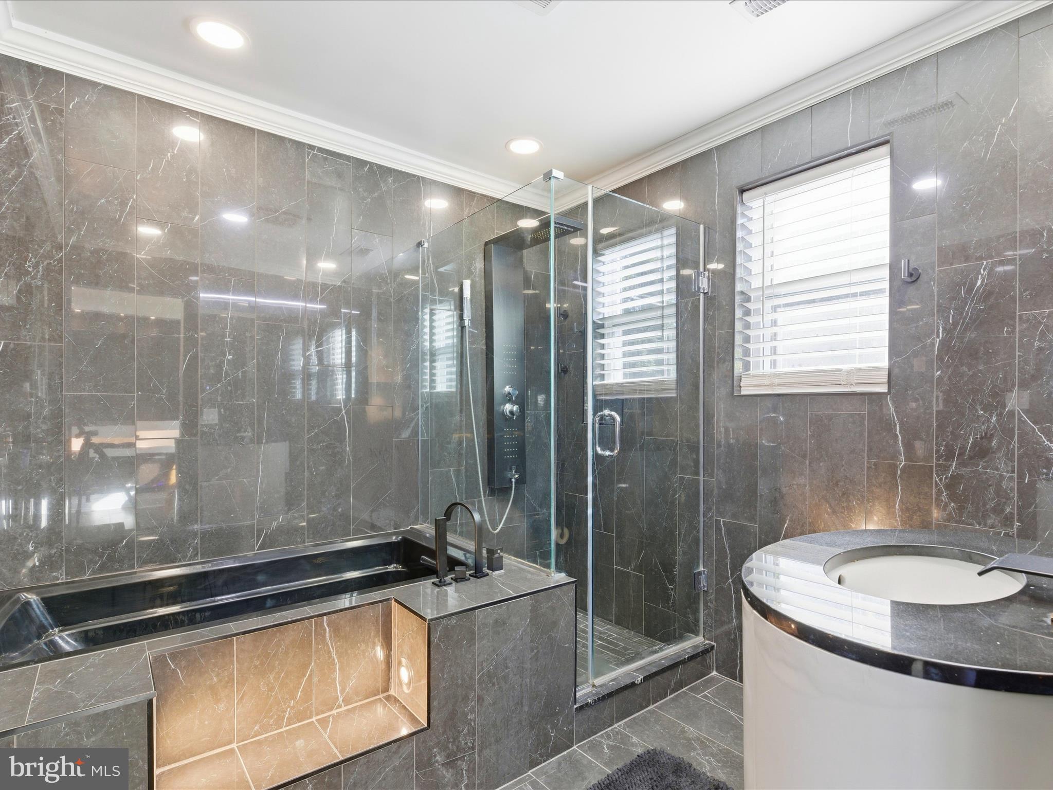 2717 Branch Avenue Southeast Washington, DC 20020 - Photo 29 of 51 a bathroom with a granite countertop sink a toilet a mirror and shower