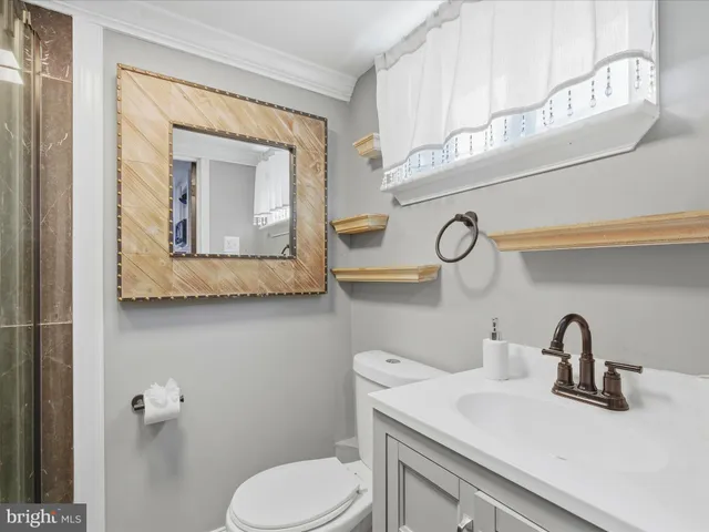 a bathroom with a shower and a sink