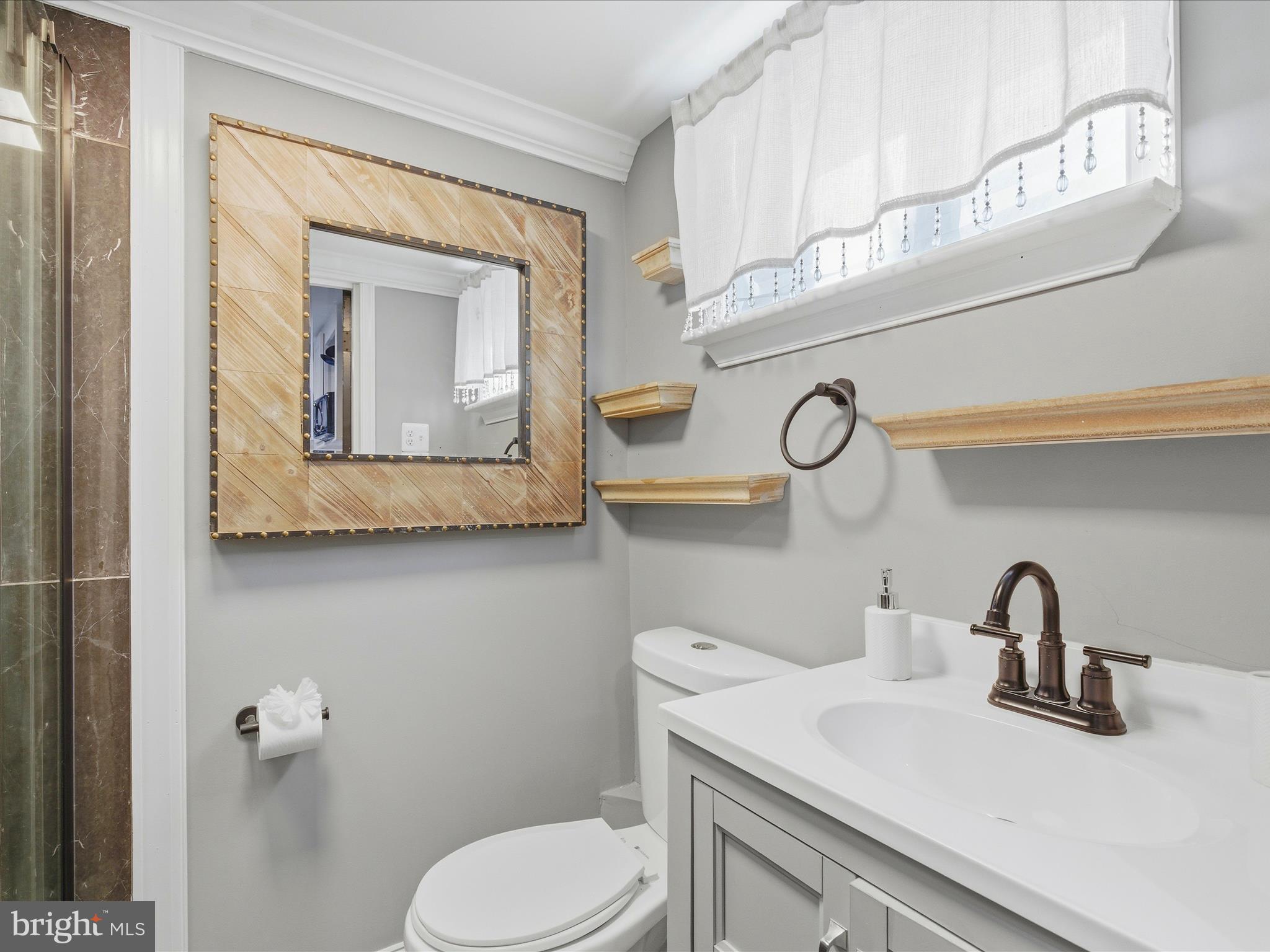 2717 Branch Avenue Southeast Washington, DC 20020 - Photo 36 of 51 a bathroom with a toilet sink and mirror