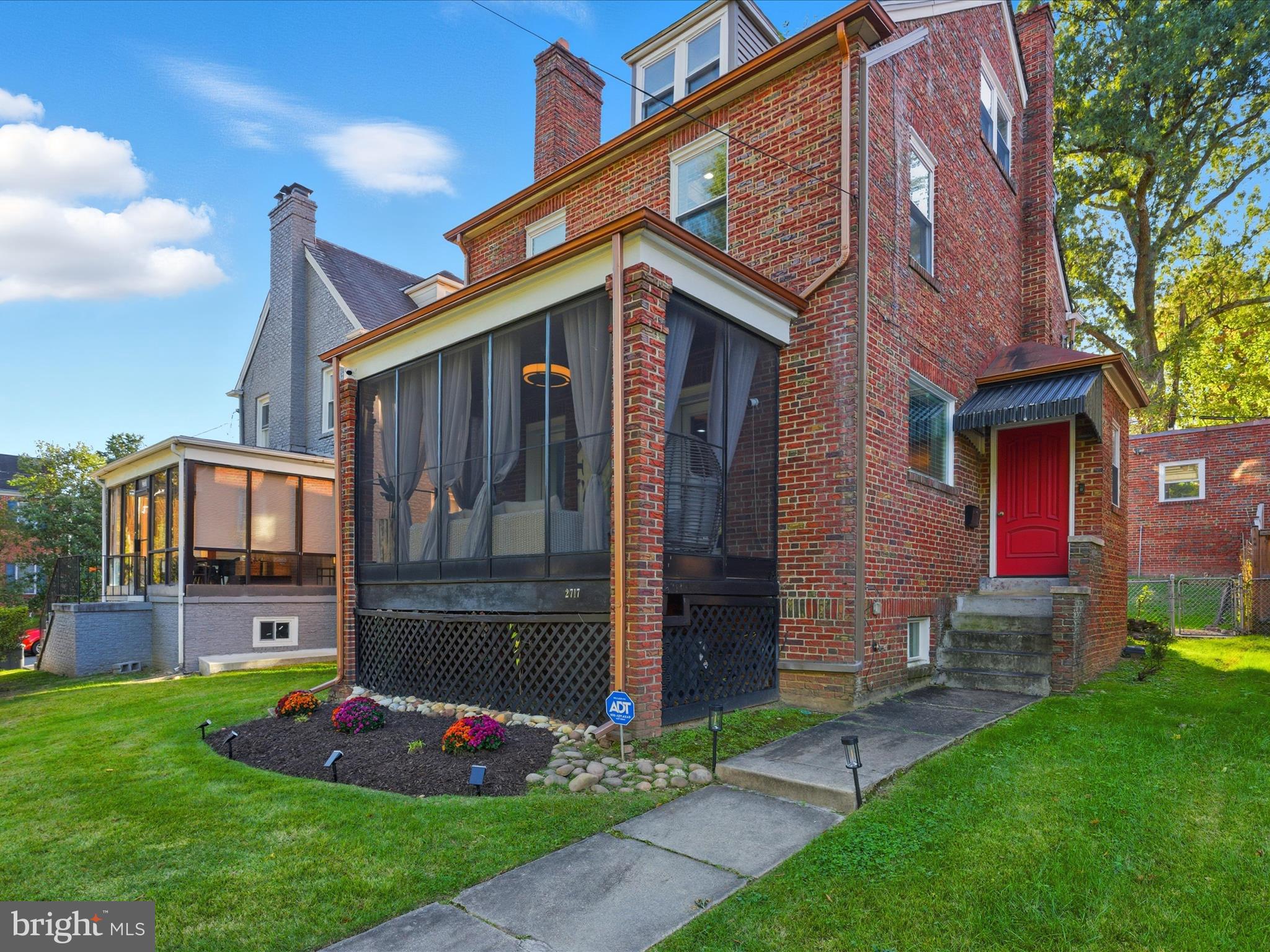 2717 Branch Avenue Southeast Washington, DC 20020 - Photo 4 of 51 a front view of a house with garden