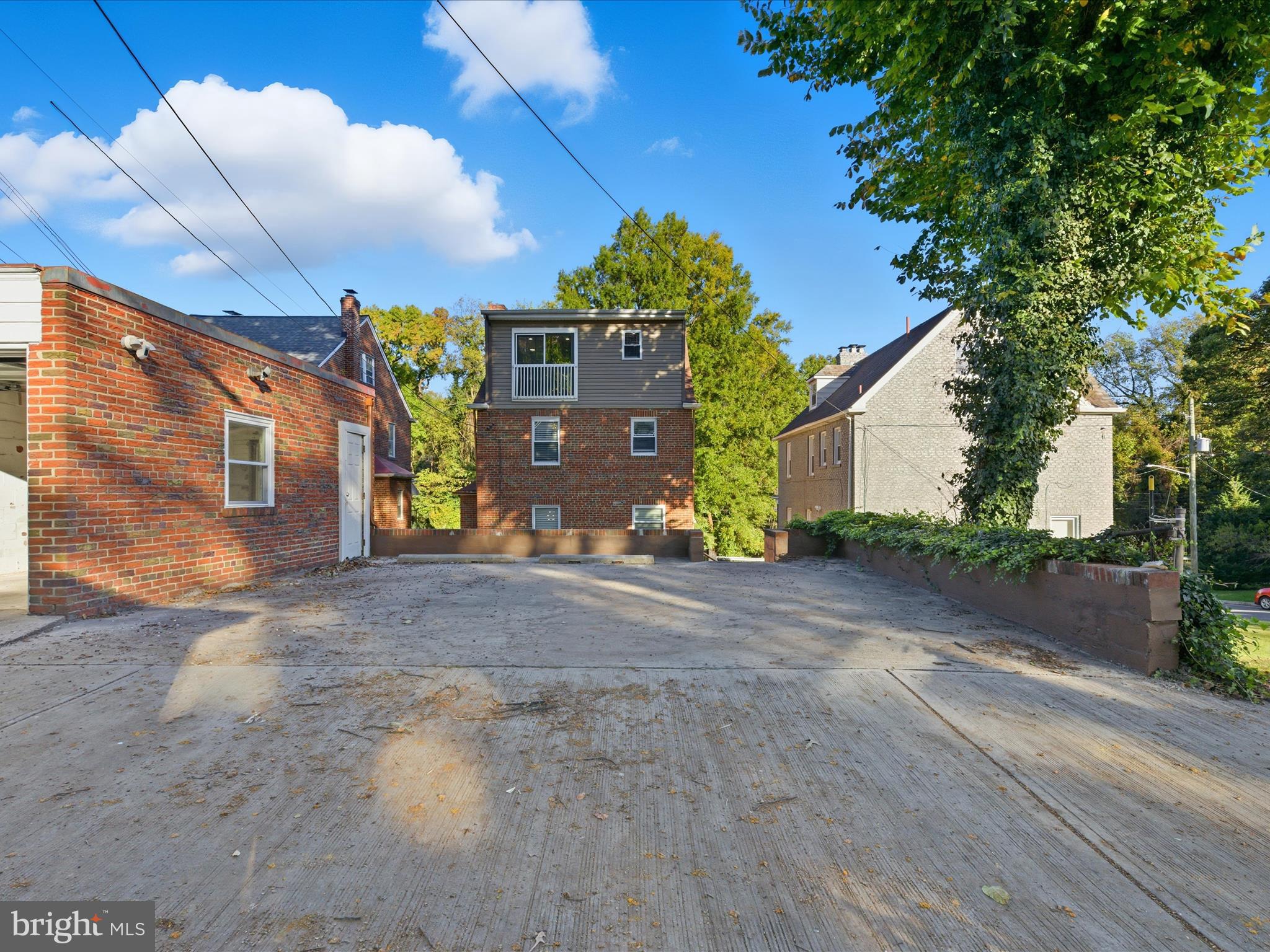 2717 Branch Avenue Southeast Washington, DC 20020 - Photo 46 of 51 a front view of a house with a yard and a garage