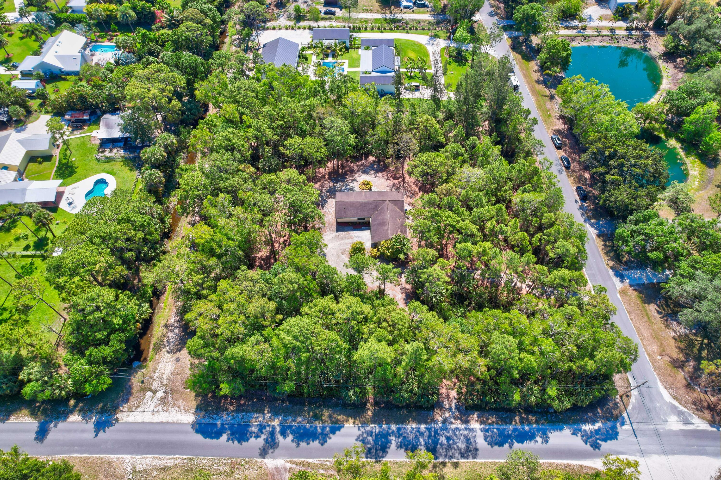 11473 154th Road North Jupiter, FL 33478 - Photo 3 of 24 Side View of Property