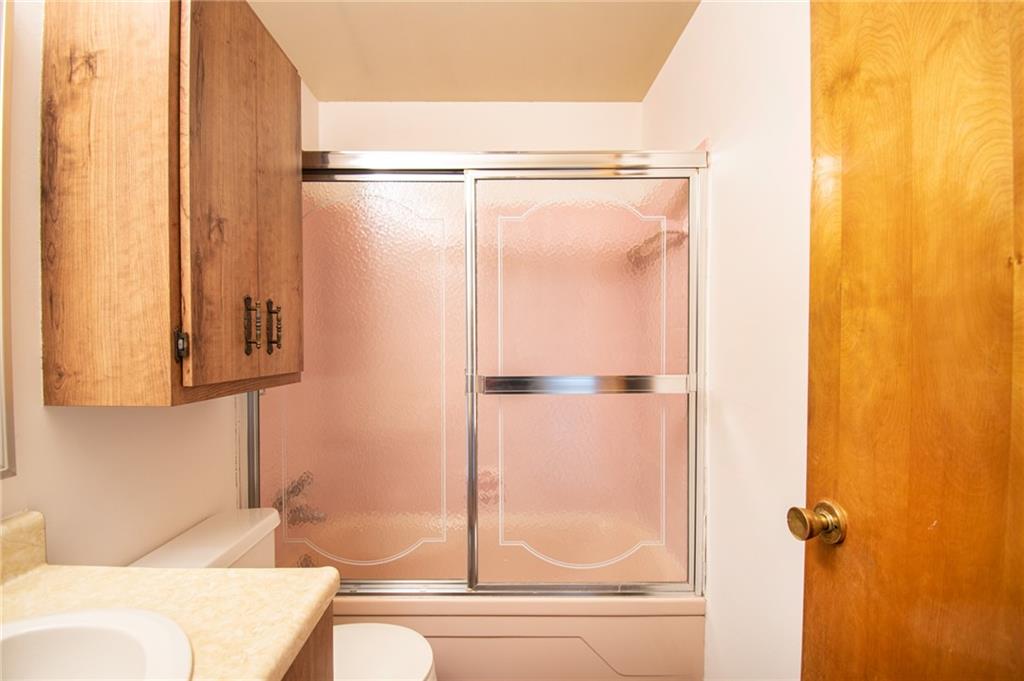 113 Newgate Drive Monaca, PA 15061 - Photo 12 of 18 a bathroom with a shower and a toilet