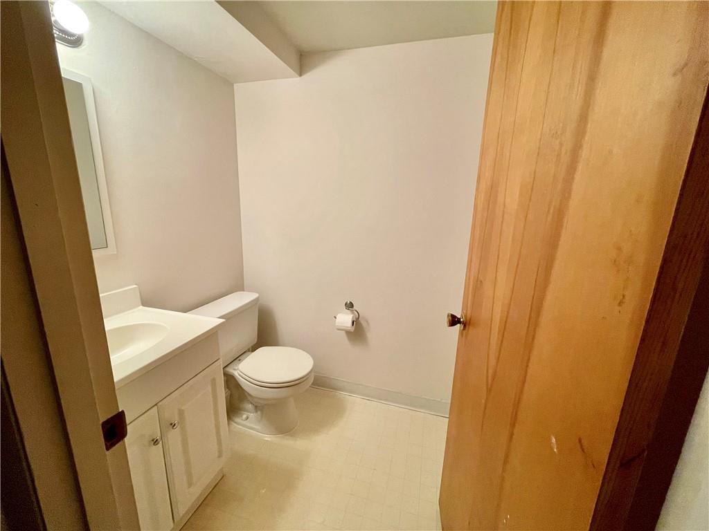 113 Newgate Drive Monaca, PA 15061 - Photo 15 of 18 a white toilet sitting next to a sink