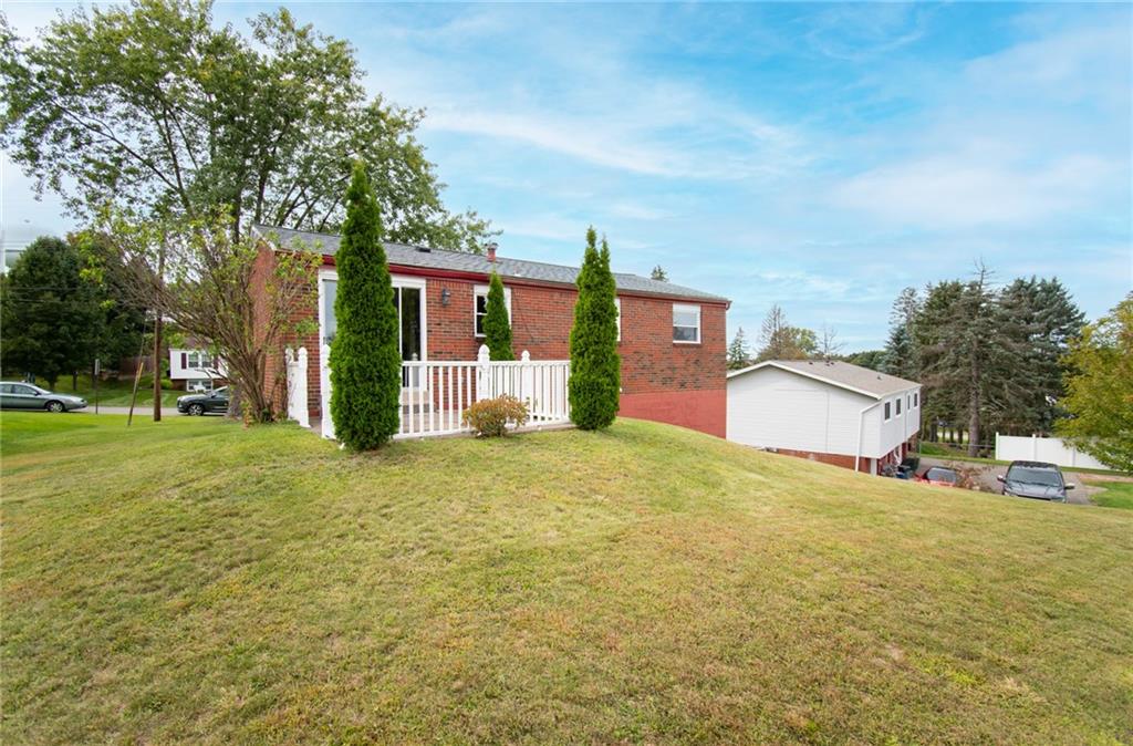 113 Newgate Drive Monaca, PA 15061 - Photo 18 of 18 a view of a house with a yard and garage