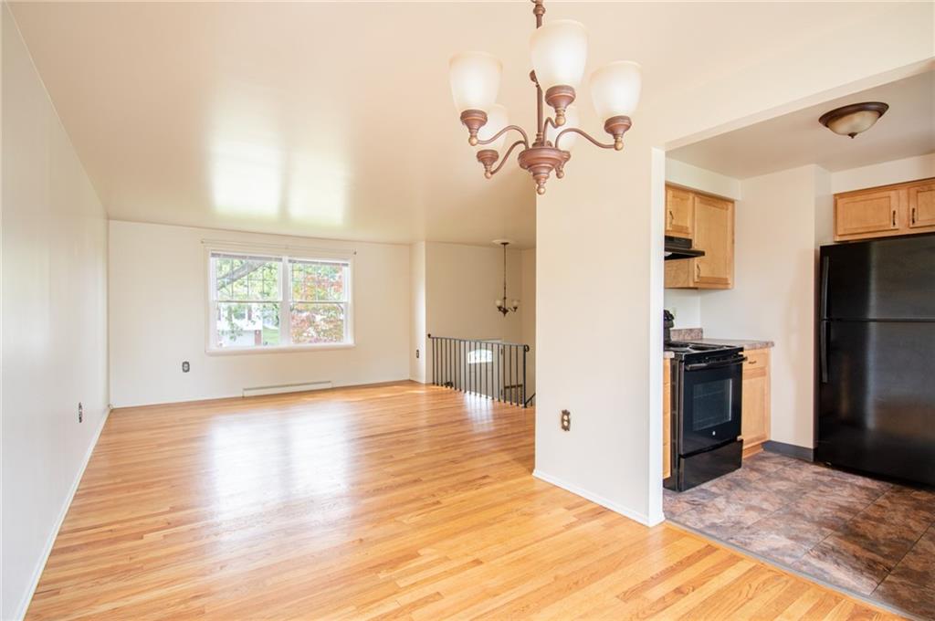 113 Newgate Drive Monaca, PA 15061 - Photo 6 of 18 a view of a kitchen with a sink and refrigerator