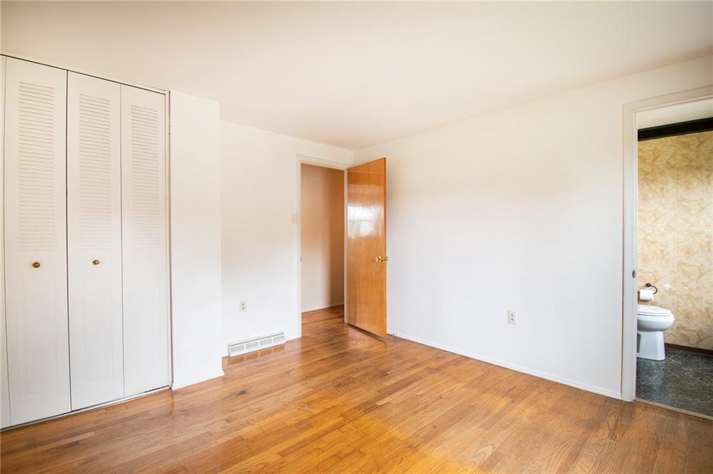 113 Newgate Drive Monaca, PA 15061 - Photo 10 of 18 a view of a room with wooden floor and bathroom