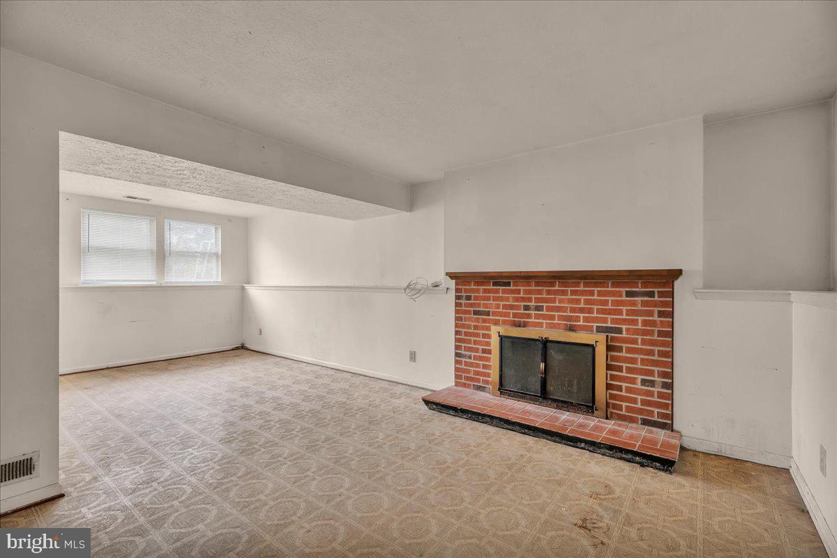 11 Decatur Lane Sicklerville, NJ 08081 - Photo 18 of 24 an empty room with a fireplace and window