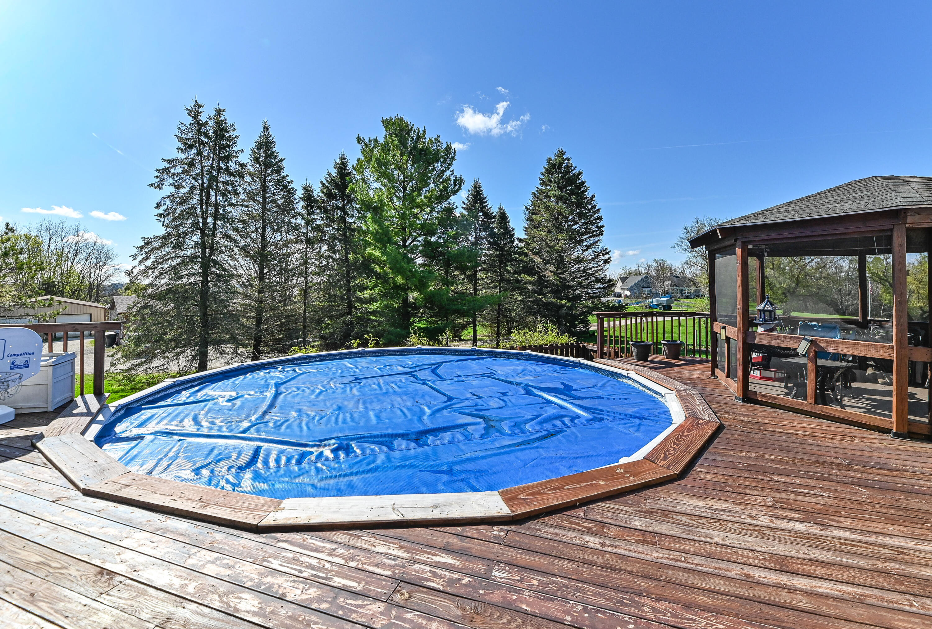 S51W30943 Old Village Road Genesee, WI 53149 - Photo 32 of 36 Above ground pool and deck