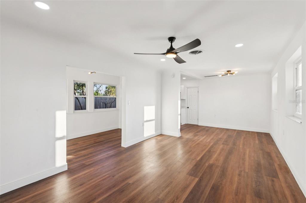 410 Virginia Avenue Madeira Beach, FL 33708 - Photo 6 of 25 a view of empty room with wooden floor and ceiling fan