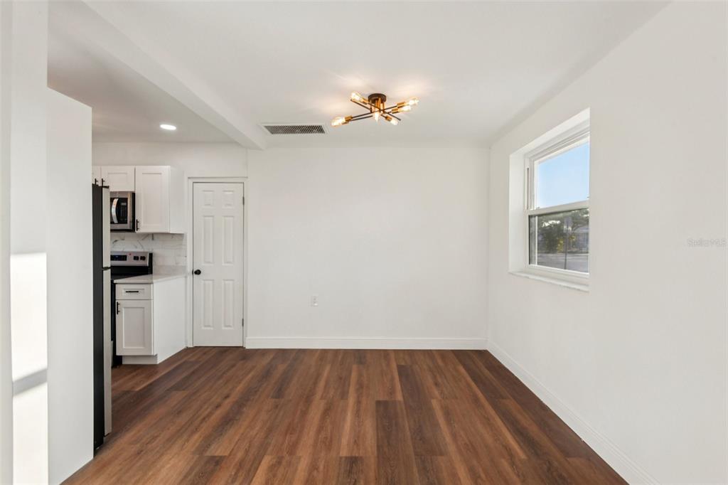 410 Virginia Avenue Madeira Beach, FL 33708 - Photo 8 of 25 a view of a kitchen from the hallway
