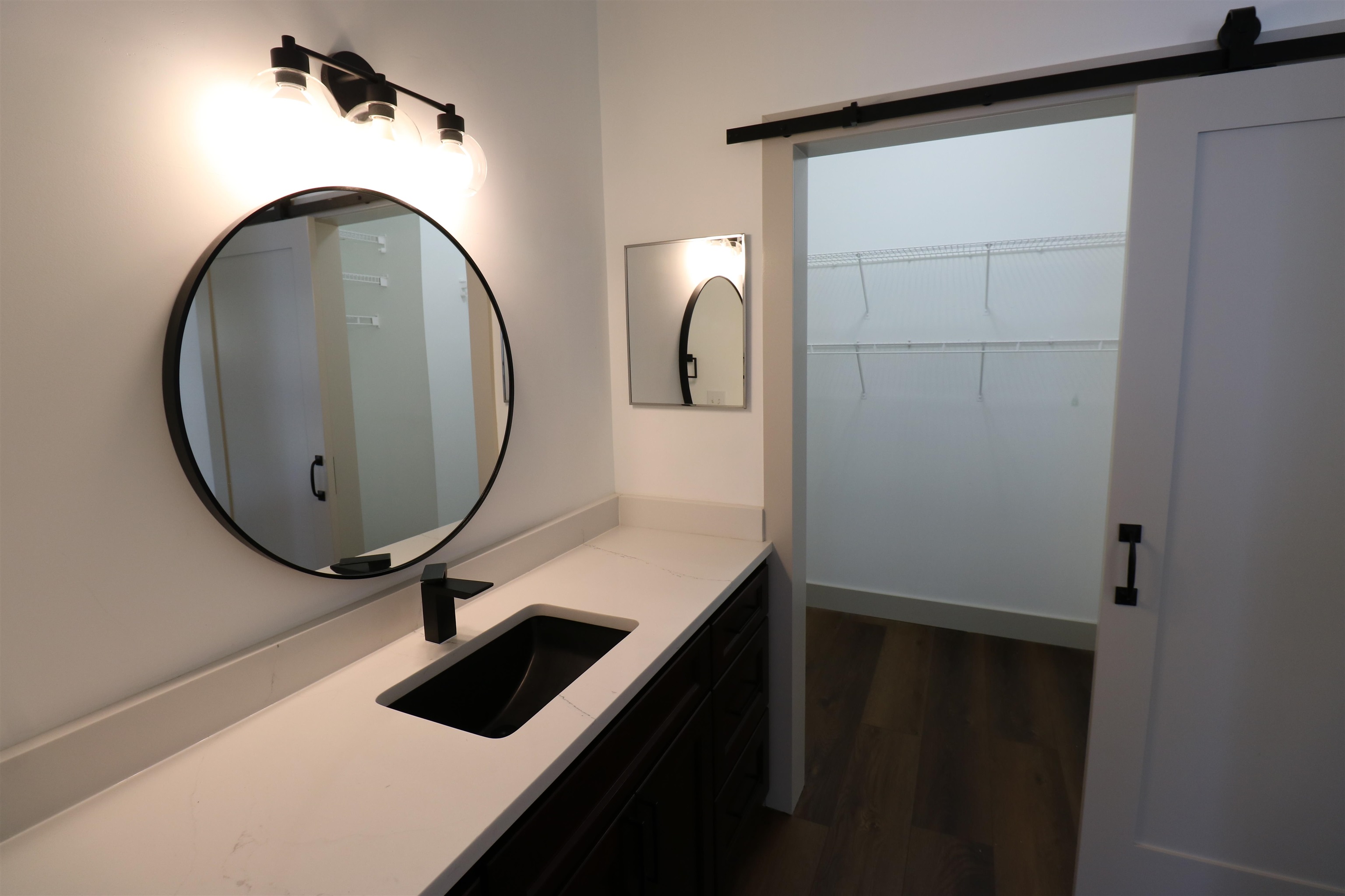 613 Augusta Circle St. Augustine, FL 32086 - Photo 16 of 26 a bathroom with a sink and a mirror