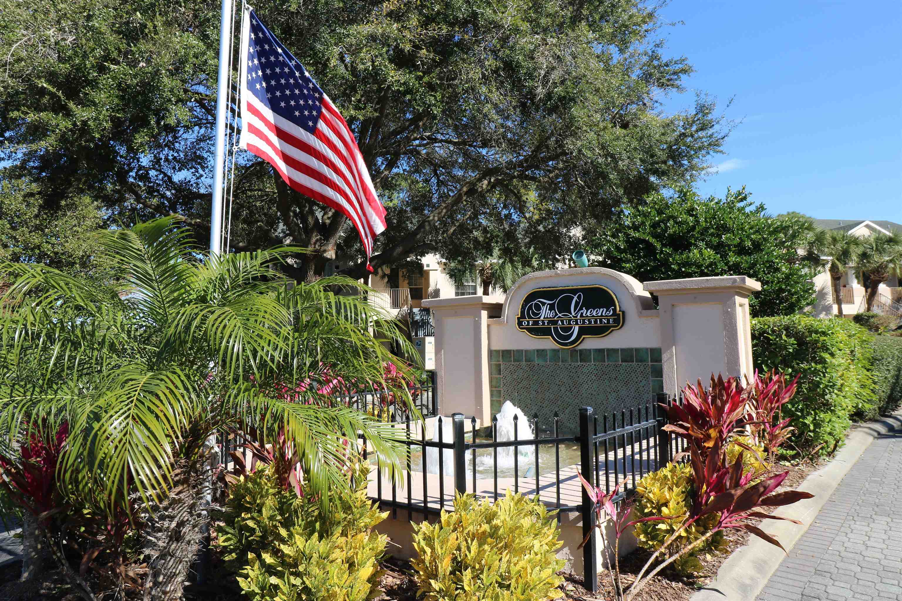 613 Augusta Circle St. Augustine, FL 32086 - Photo 22 of 26 a front view of a house with a yard and sitting area
