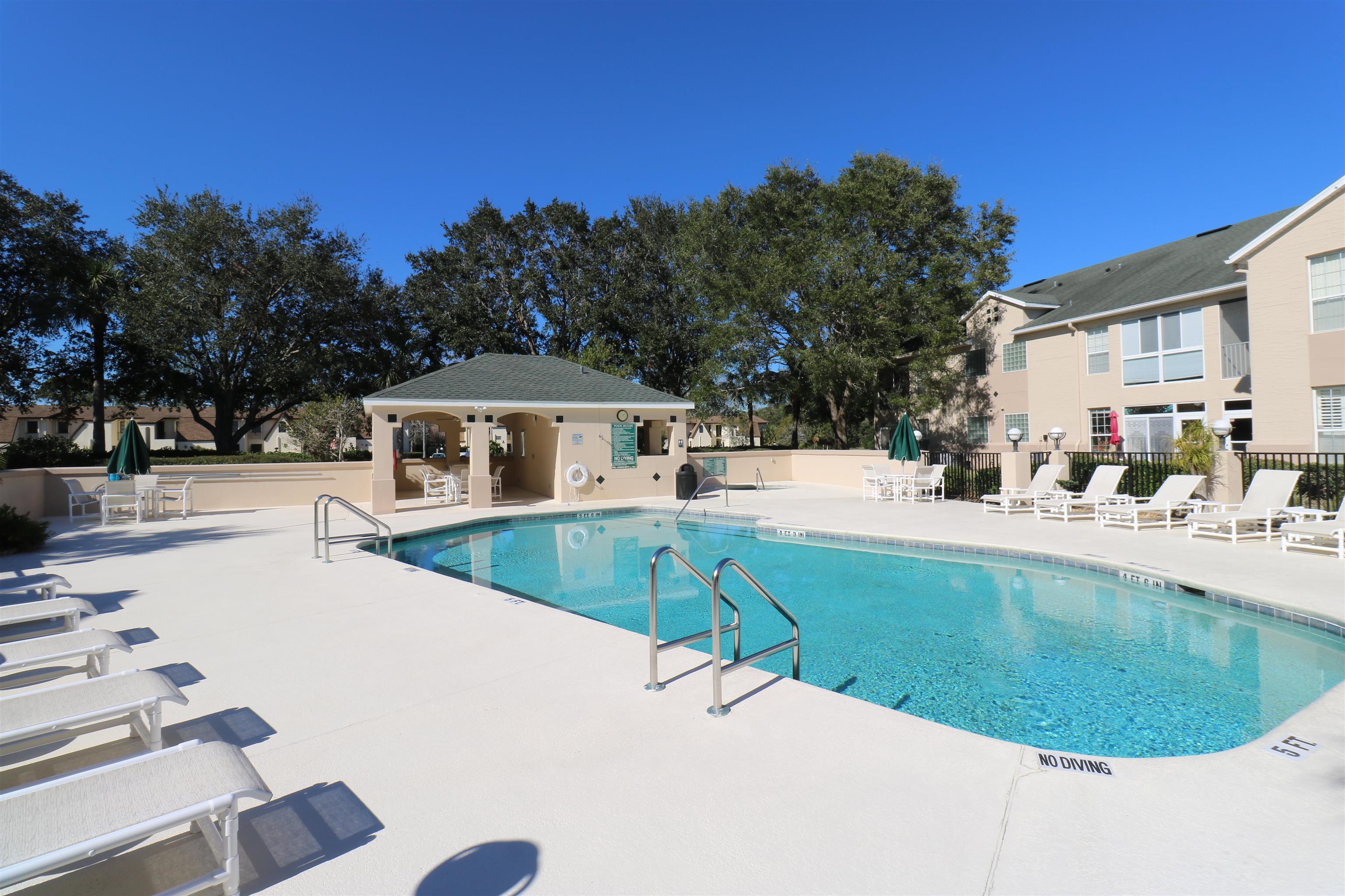 613 Augusta Circle St. Augustine, FL 32086 - Photo 24 of 26 a view of a house with swimming pool
