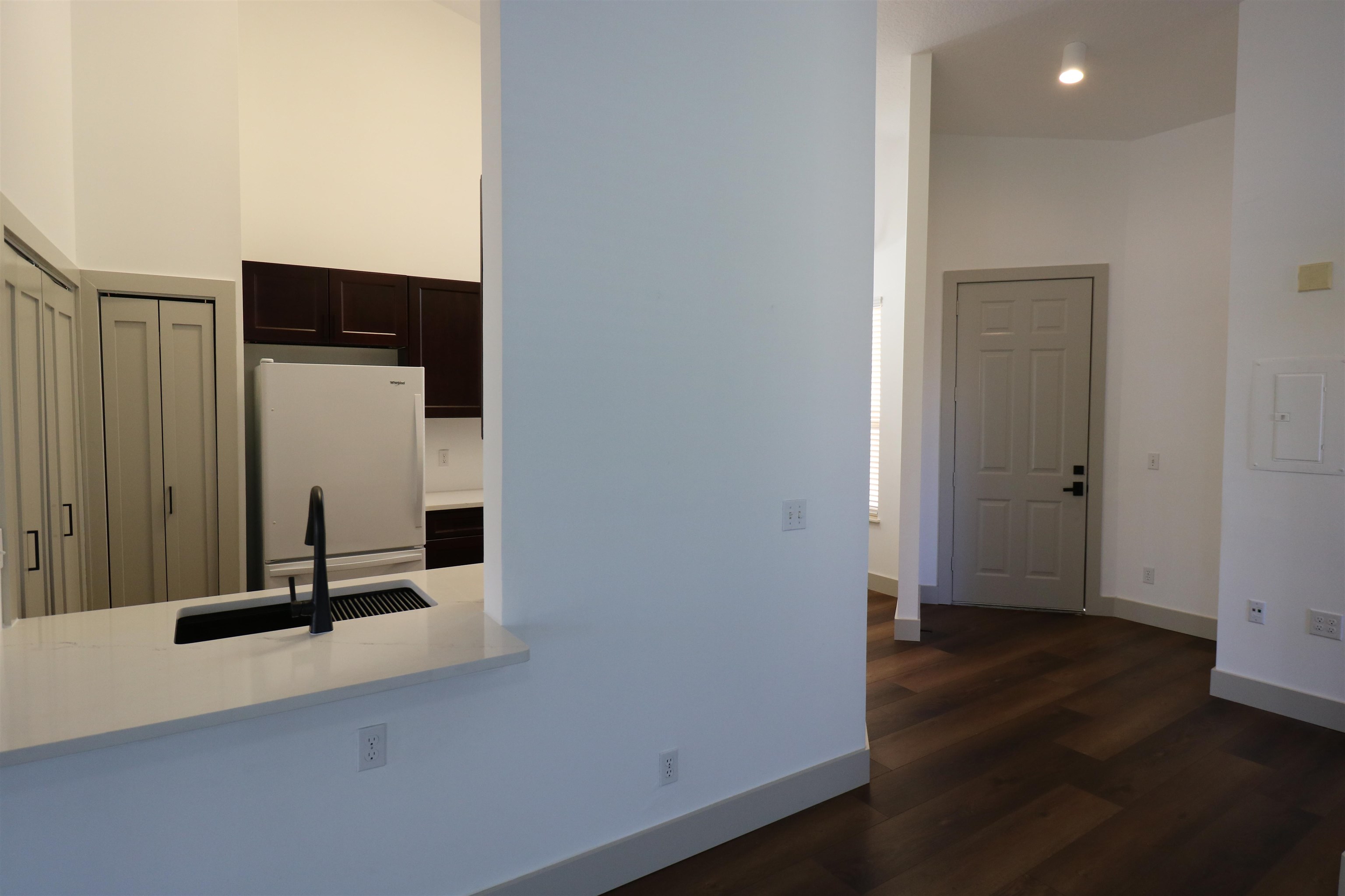 613 Augusta Circle St. Augustine, FL 32086 - Photo 4 of 26 an empty room with wooden floor and windows