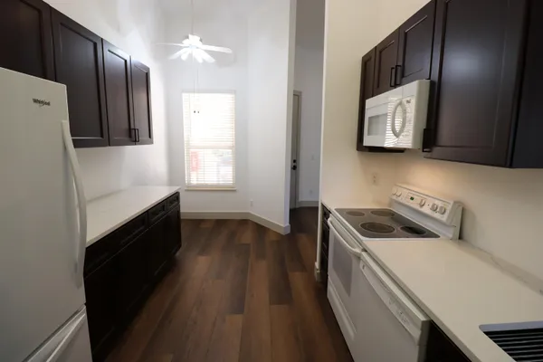 a kitchen with a stove and a refrigerator