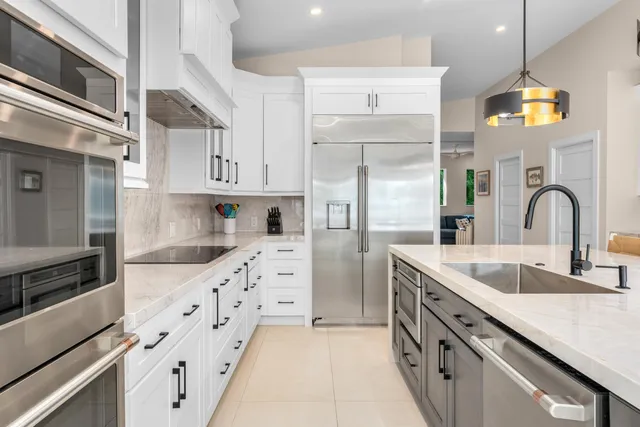 a spacious bathroom with a tub sink and mirror