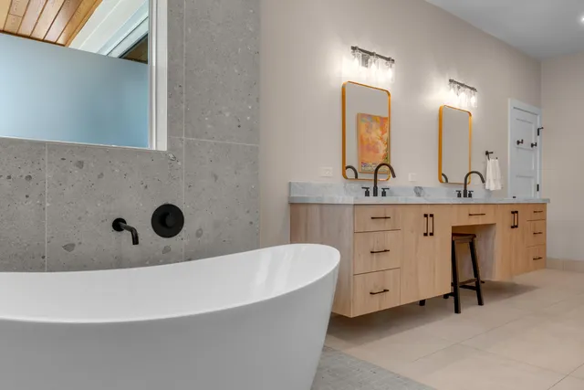 a bedroom with a bed and a tv