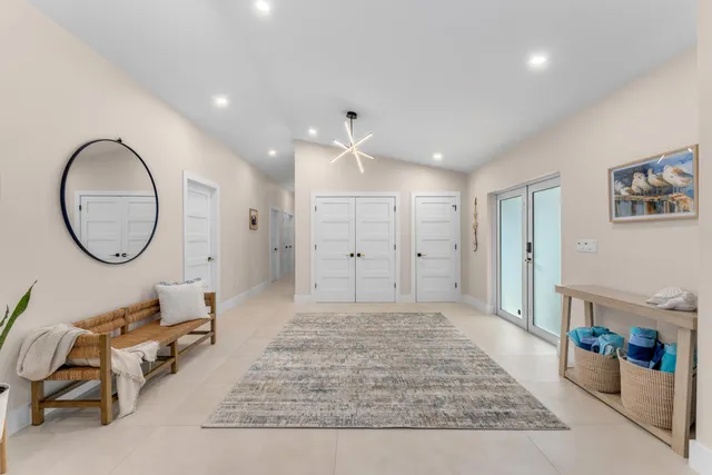 a bedroom with a bed and a potted plant