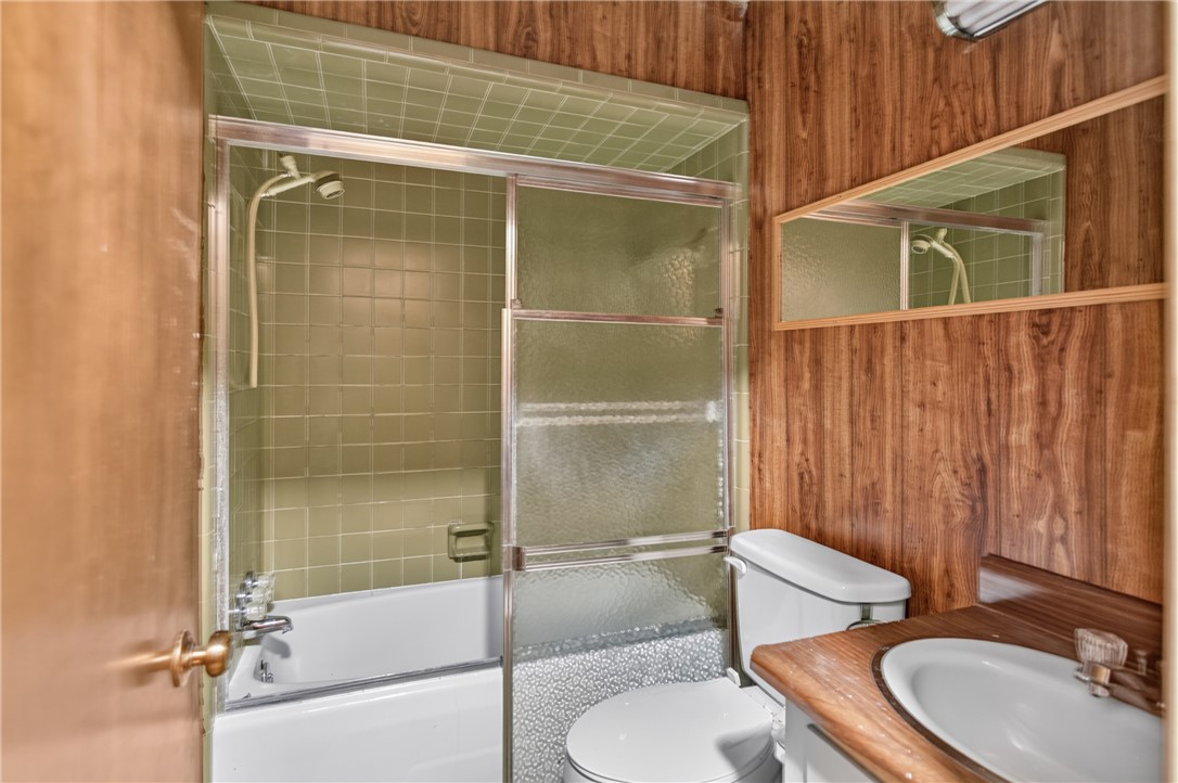 1412 Simpson Road Pendleton, SC 29670 - Photo 20 of 48 Timeless bathroom featuring a full bathtub and a unique wood panel accent wall.