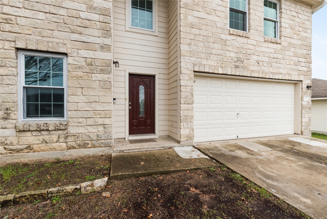 1329 Amberwood Loop Kyle, TX 78640 - Photo 24 of 25 a front view of a house with a yard