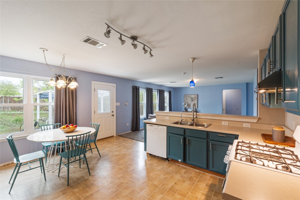 1329 Amberwood Loop Kyle, TX 78640 - Photo 3 of 25 a outdoor space with a kitchen island furniture and a kitchen view
