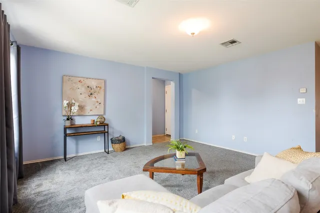 a living room with furniture and furniture