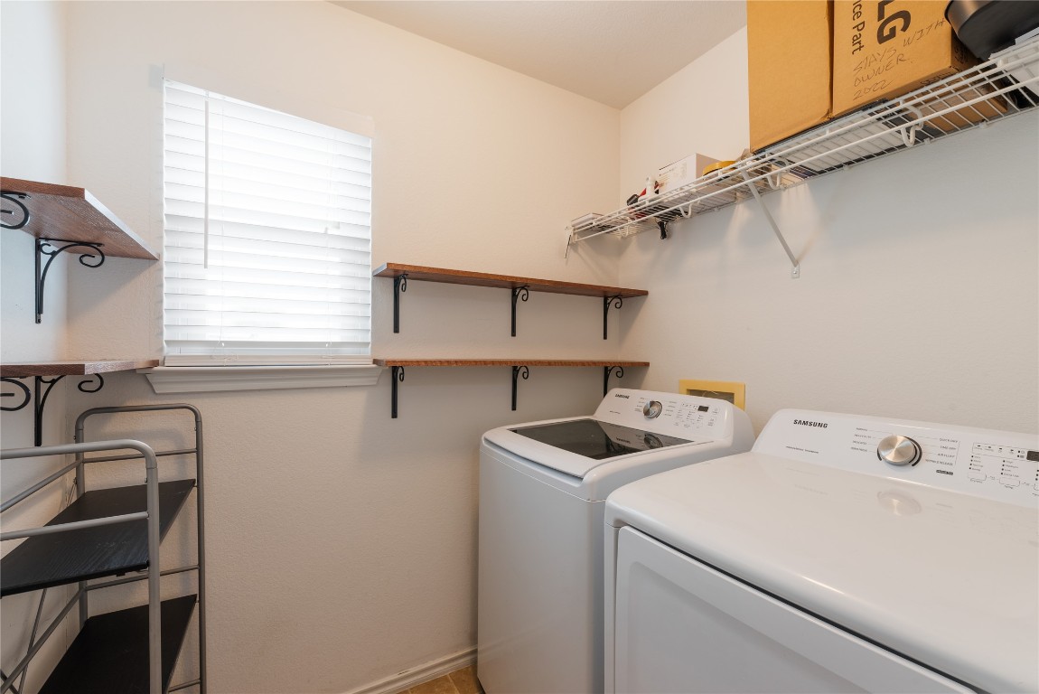 1329 Amberwood Loop Kyle, TX 78640 - Photo 10 of 25 a view of storage and utility room with washer and dryer
