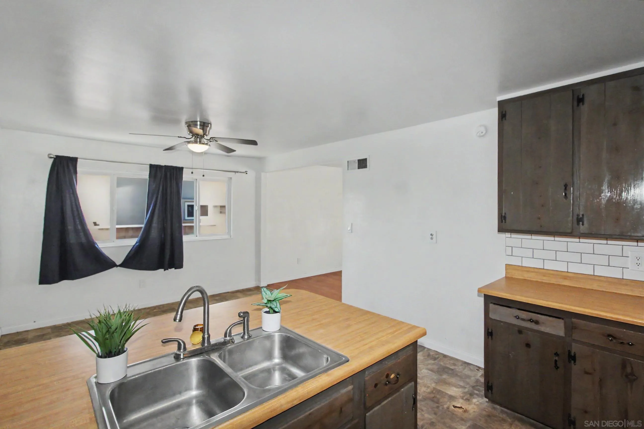 8766 Kelso Street Spring Valley, CA 91977 - Photo 14 of 44 a bathroom with a sink and a mirror