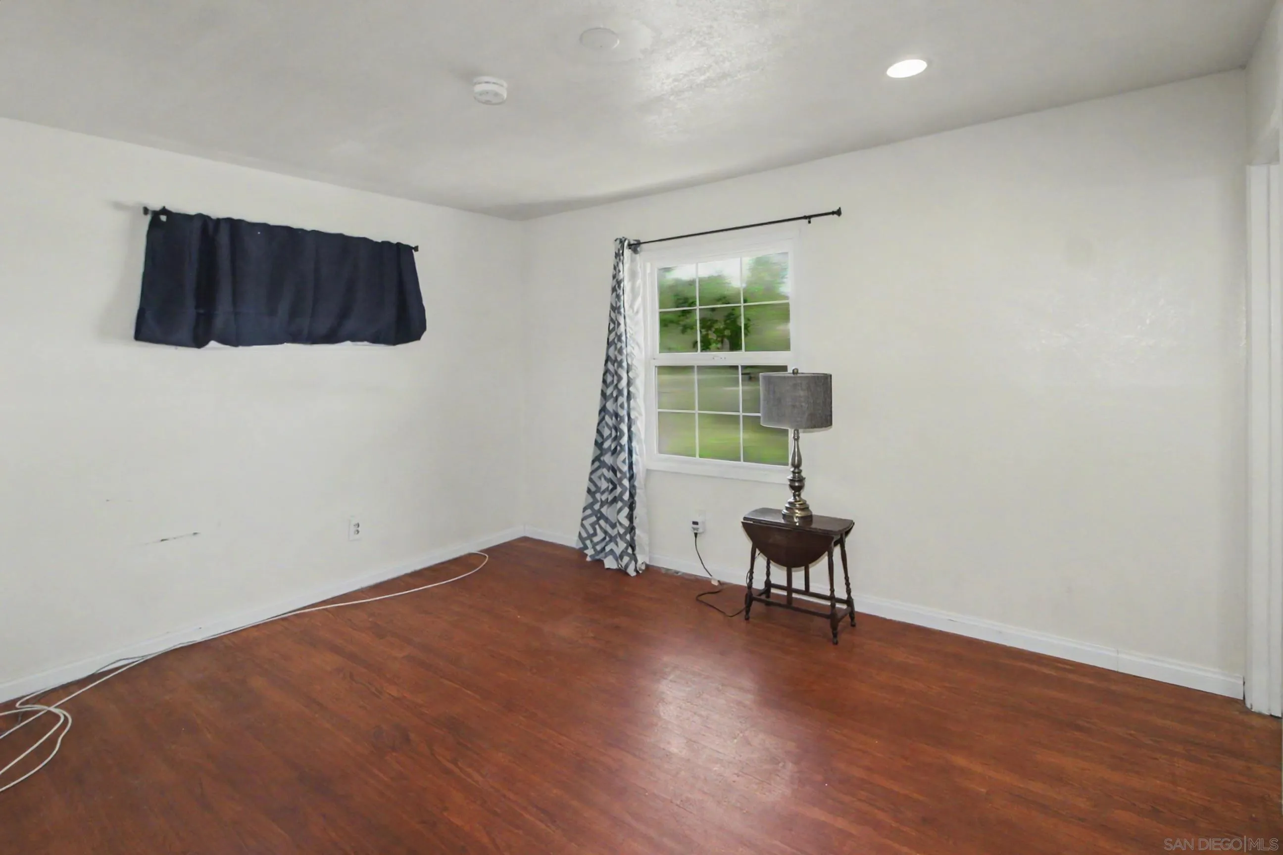 8766 Kelso Street Spring Valley, CA 91977 - Photo 20 of 44 a hallway with a chair and a window