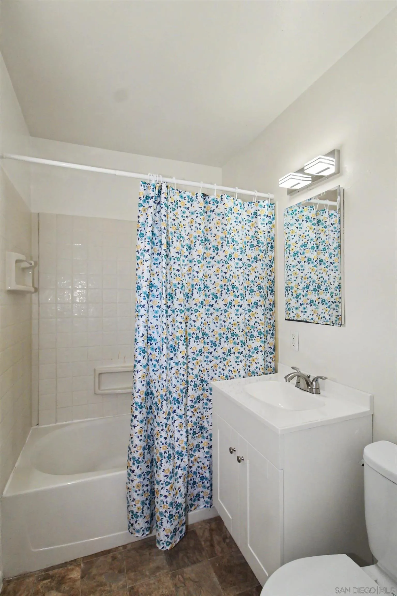 8766 Kelso Street Spring Valley, CA 91977 - Photo 23 of 44 a bathroom with a bathtub a sink a toilet and a shower