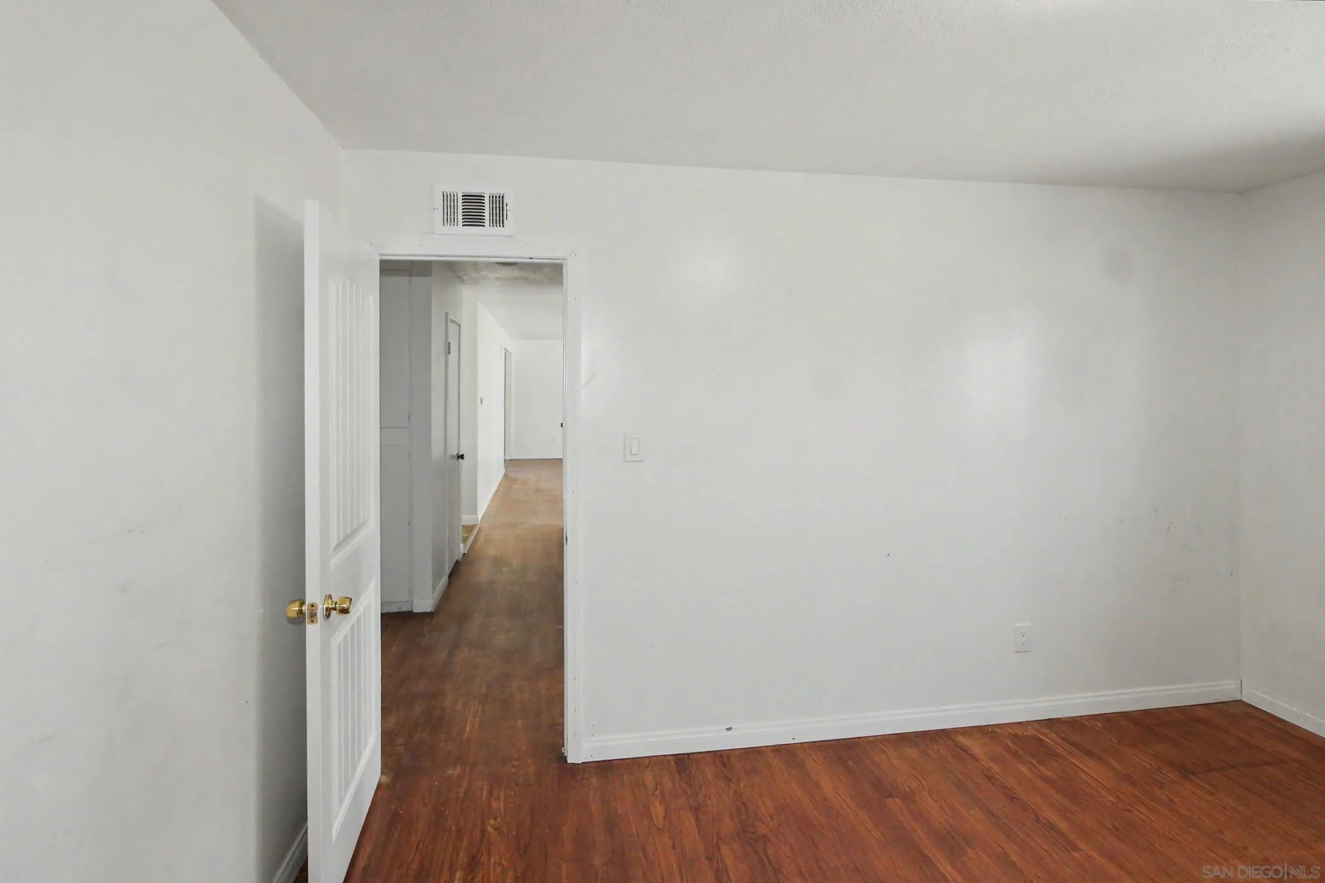 8766 Kelso Street Spring Valley, CA 91977 - Photo 26 of 44 a view of a hallway with wooden floor