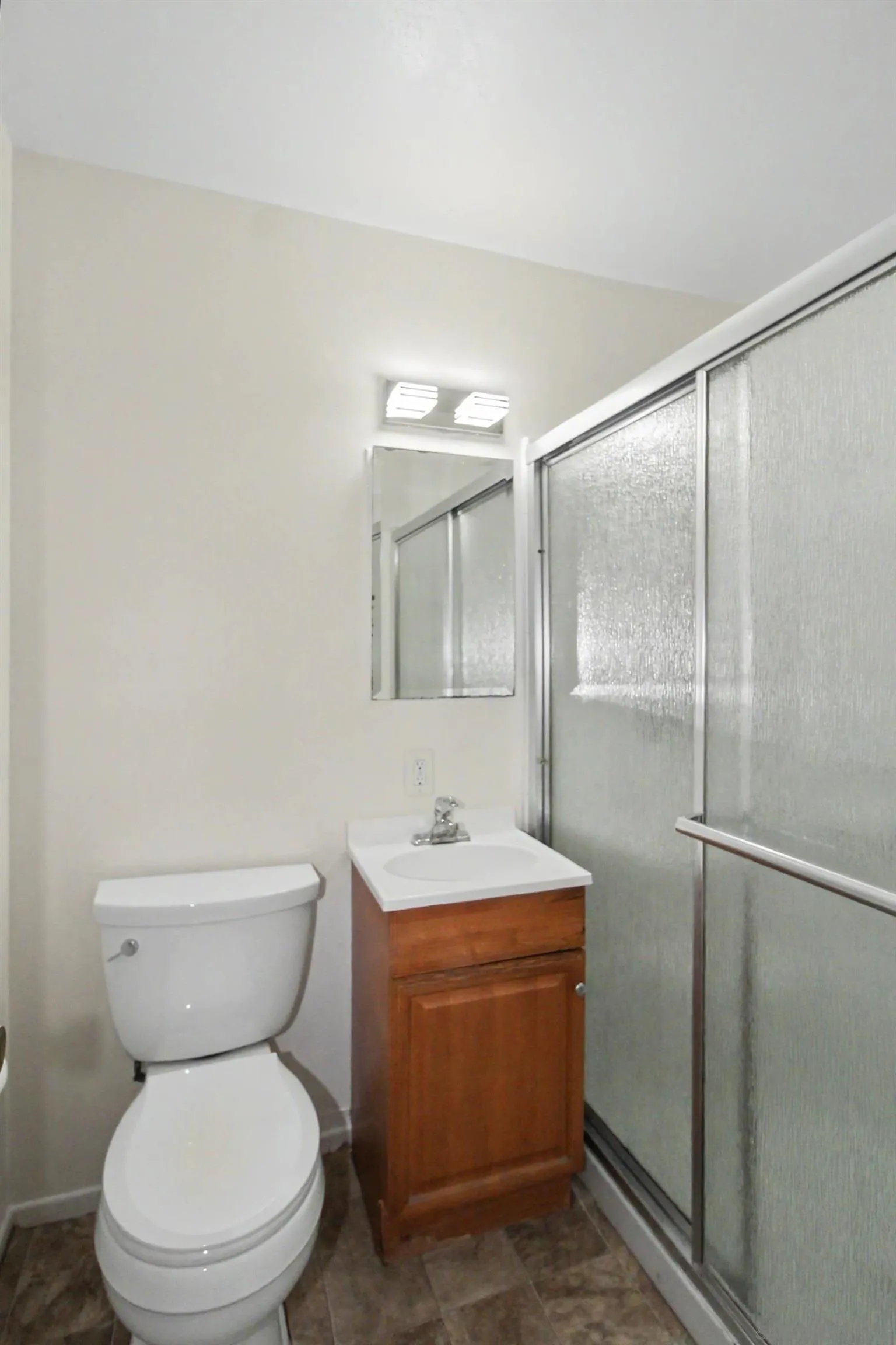 8766 Kelso Street Spring Valley, CA 91977 - Photo 27 of 44 a bathroom with a toilet sink vanity and mirror