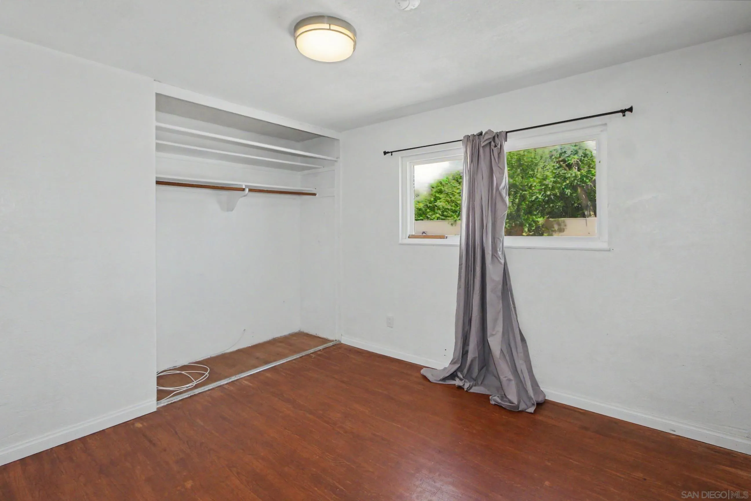 8766 Kelso Street Spring Valley, CA 91977 - Photo 28 of 44 an empty room with a empty space and a window