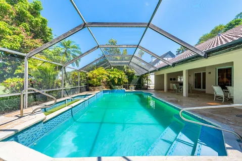 a view of swimming pool with a patio
